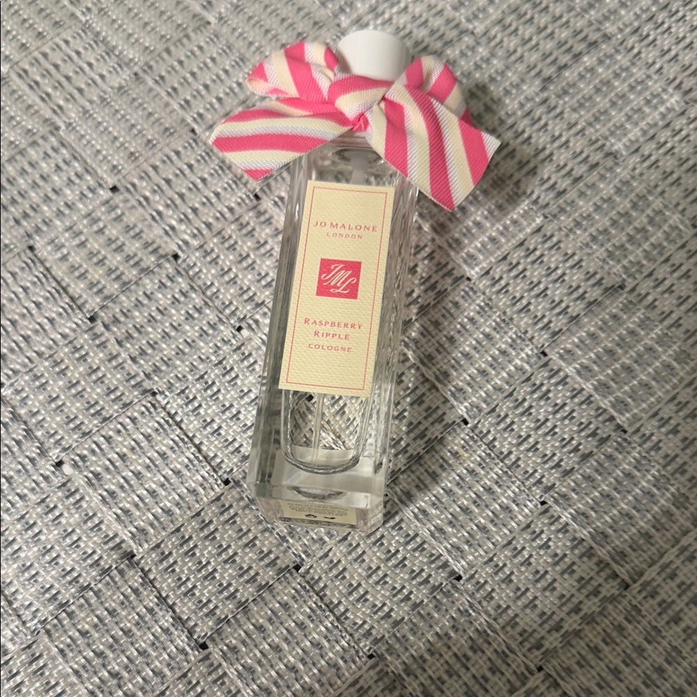 Jo Malone clear bottle with pink striped bow